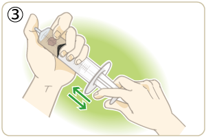 注射器の口をしっかりと指で押さえながら、ピストンを前後します。